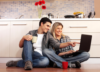 couple_using_laptop_computer_kitchen-1.jpg