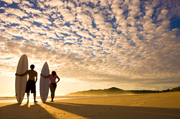 couple_surfing_beach_newlyweds_1.jpg